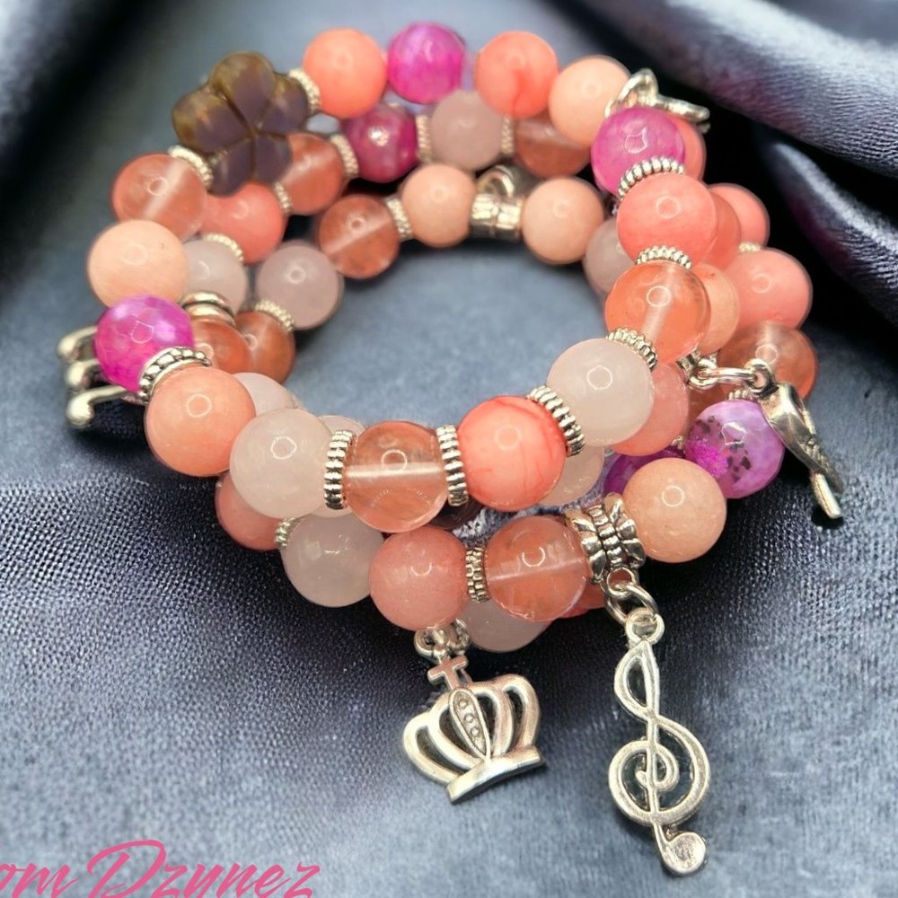 Multi colored pink beaded memory wire with musicals instrument  charms